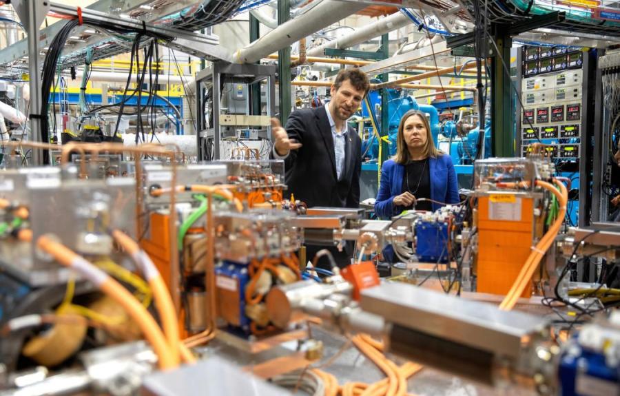Georg Hoffstaetter, professor of physics, and Alicia Barton, president and CEO of the New York State Energy Research and Development Authority, tour the Cornell-Brookhaven ERL Test Accelerator facility.