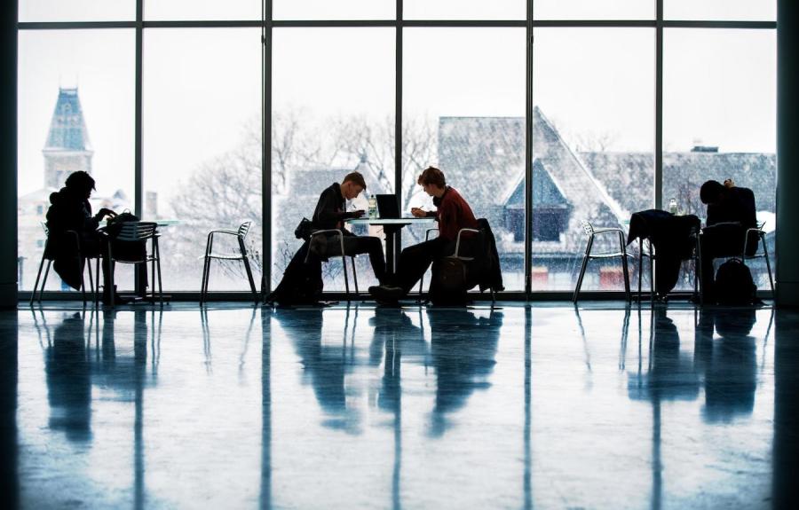 Students study in the Baker Portico of the Physical Sciences Building.