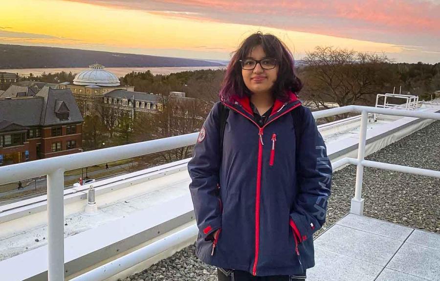 Ariel Baksh on balcony at sunset.